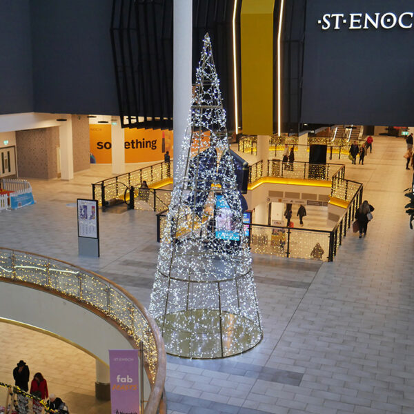 giant lit christmas tree in shopping centre with icicle lights
