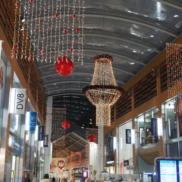 Shopping centre street with Christmas lights and decorations.