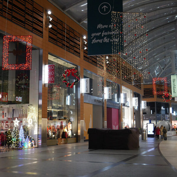 Shopping centre street with Christmas lights and decorations.