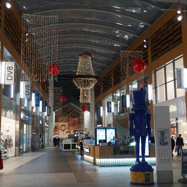 Shopping centre street with Christmas lights and decorations.
